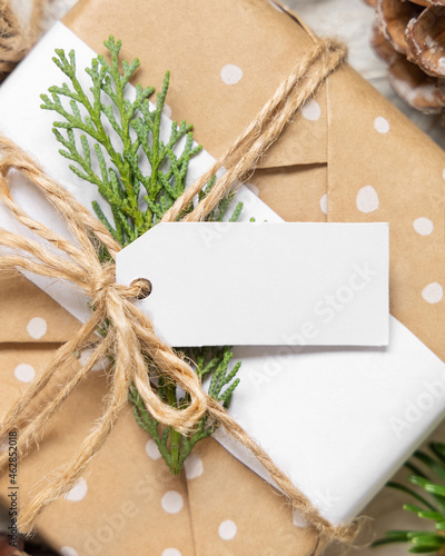 Christmas present with blank gift tag top view, Mockup