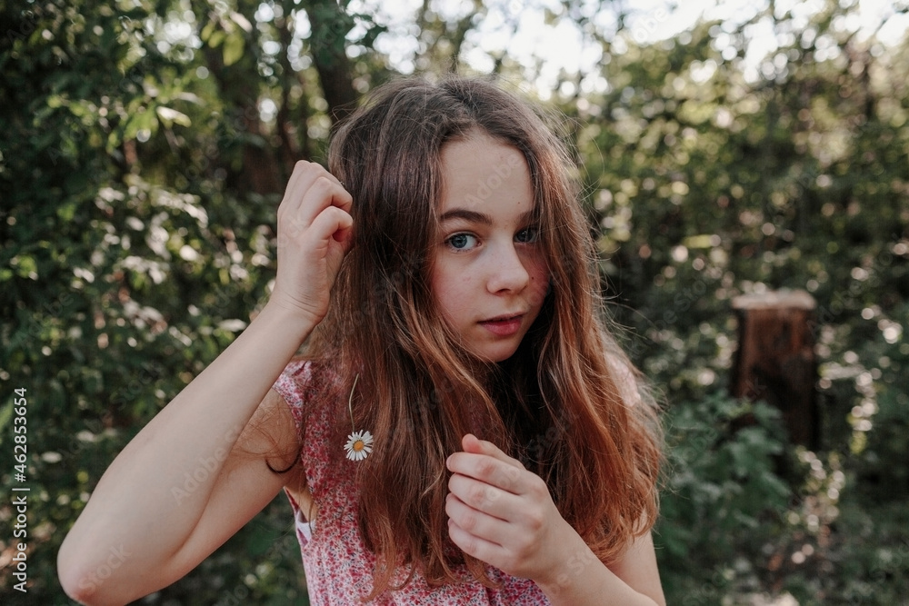 Portrait of a girl with flowers in her hair Portrait of a girl with flowers in her hair