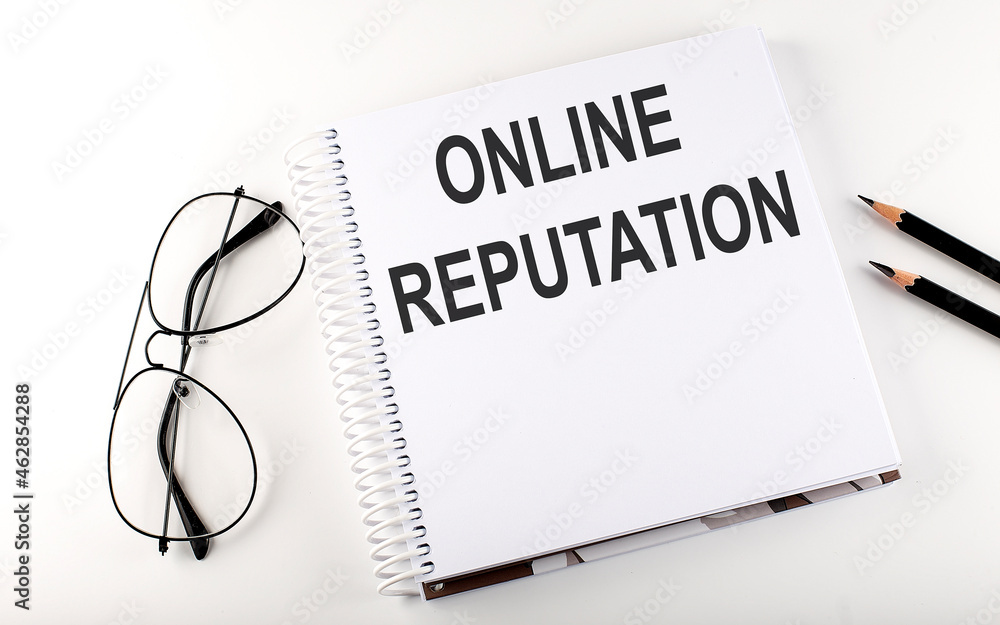 Notepad with text ONLINE REPUTATION . White background. Business concept Notepad with text ONLINE REPUTATION . White background. Business concept