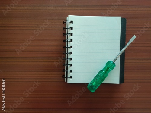 Screwdriver and a notebook