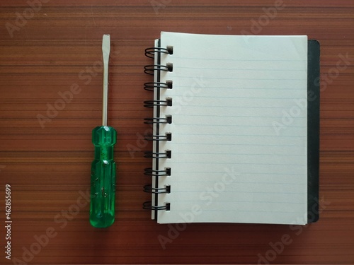 Screwdriver and a notebook