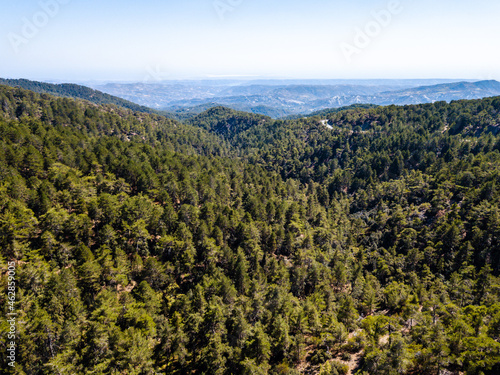 Aerial view from drone of forested rocky hills landscape © Anton Tolmachov