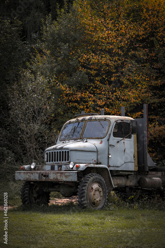 historical corroding truck in autumn nature photo