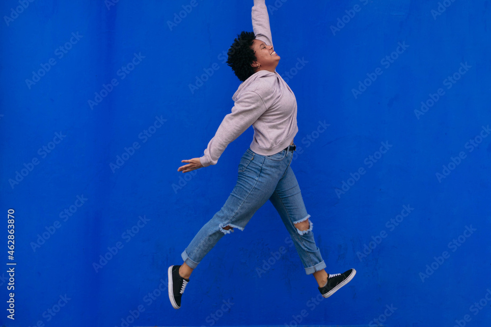 Young Stylish Afro Woman Jumping