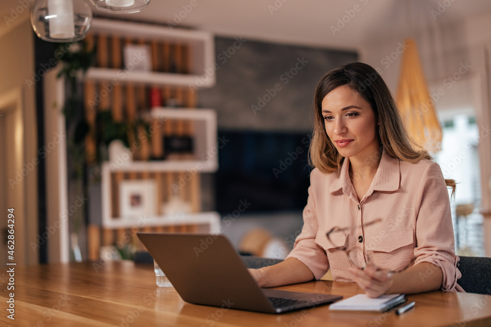 Young woman, attending a conference call. Young woman, attending a conference call.