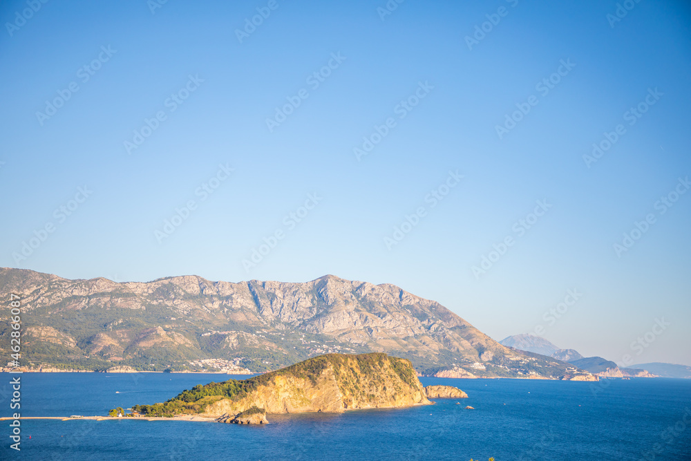 Aerial view of Sveti Nikola or St. Nicolas island is in Budva riviera on mountain background, Montenegro Aerial view of Sveti Nikola or St. Nicolas island is in Budva riviera on mountain background, Montenegro