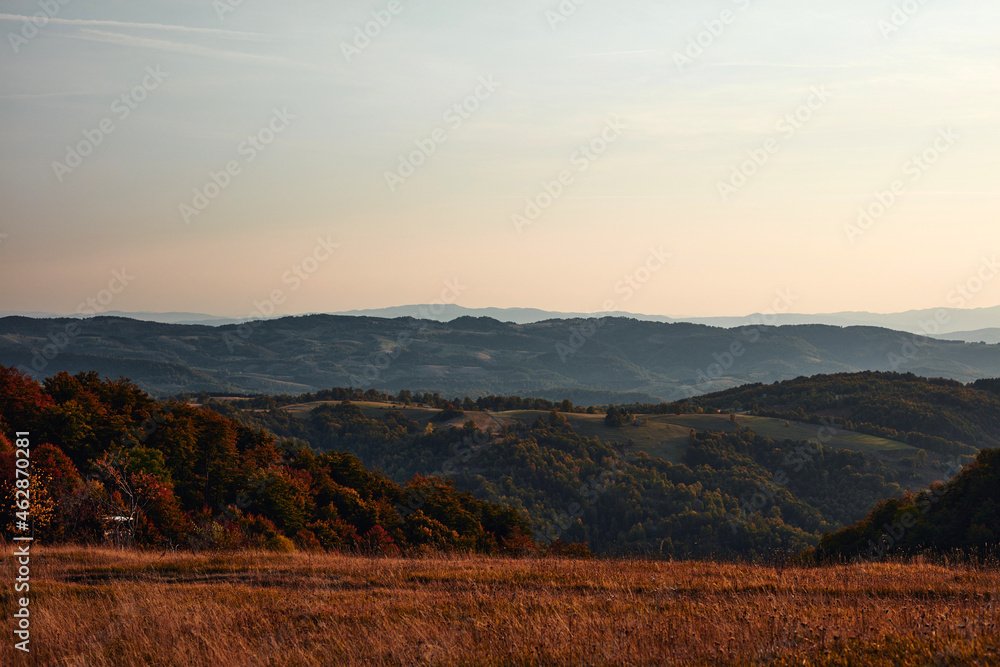 Fototapeta premium View of countryside hilly landscape in autumn colors.