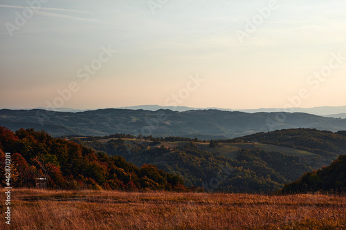 View of countryside hilly landscape in autumn colors. photo