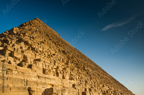 Photo of great Pyramid of Cheops from low angle near basis