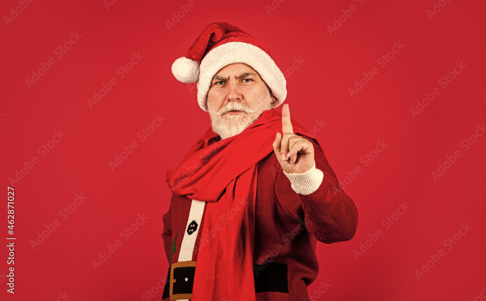 serious senior man in santa claus costume. happy new 2021 year. merry christmas. bearded santa in scarf on red background. xmas presents and gift shopping time. winter holiday joy serious senior man in santa claus costume. happy new 2021 year. merry christmas. bearded santa in scarf on red background. xmas presents and gift shopping time. winter holiday joy
