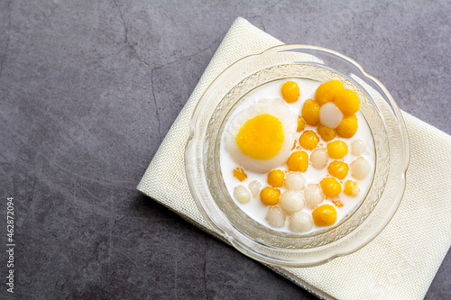 Wallpaper Mural Pumpkin (white and yellow) rice dumpling in coconut milk (Bua Loy) in transparency bowl on wooden table. Delicious Thai dessert. Torontodigital.ca