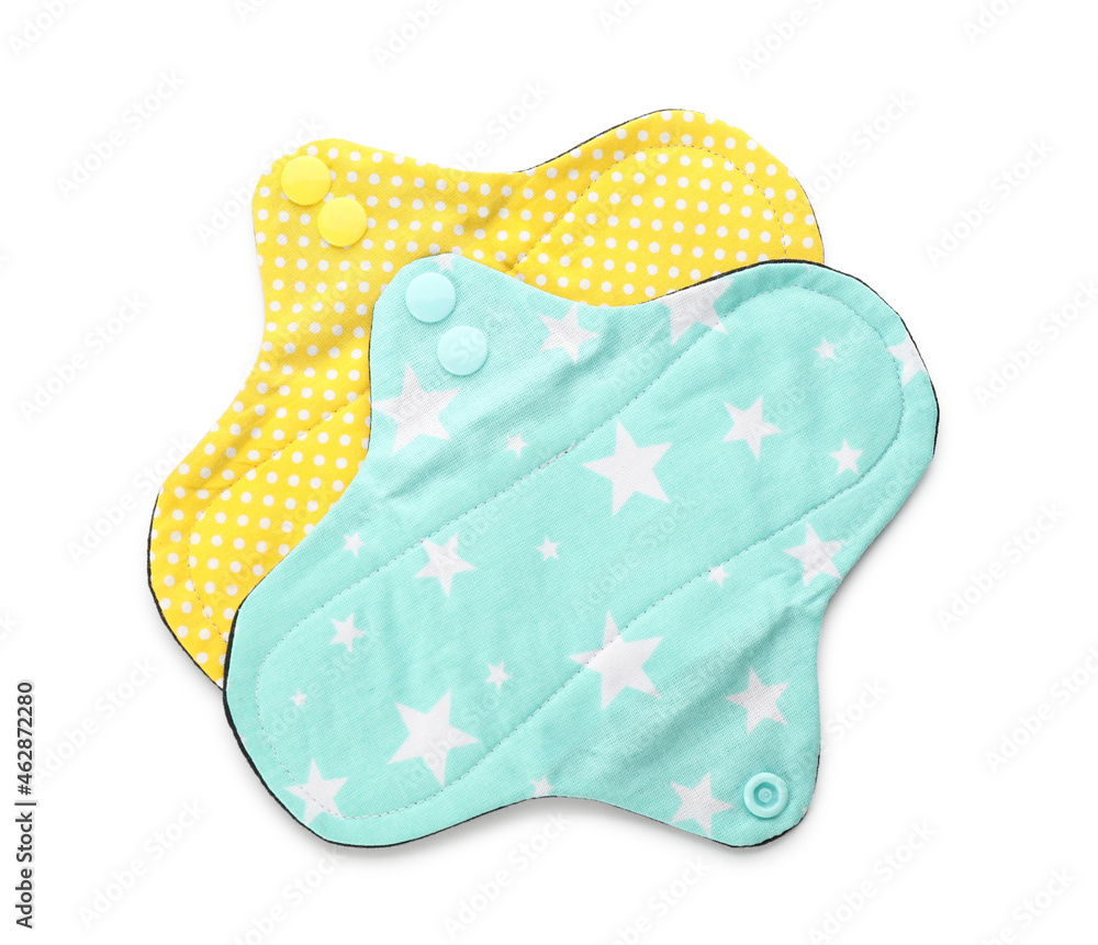 Cloth menstrual pads on white background, top view. Reusable female hygiene product Cloth menstrual pads on white background, top view. Reusable female hygiene product