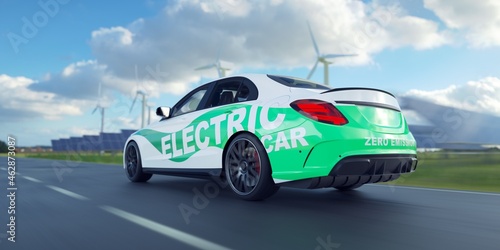 Driving an generic electric car at high speed. Solar park and wind turbines background.  © Negro Elkha