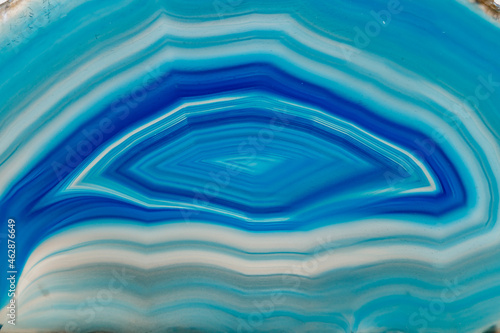 Macro mineral stone Blue Agate breed a white background