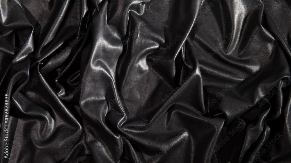 Black textured crumpled faux leather background Black textured crumpled faux leather background