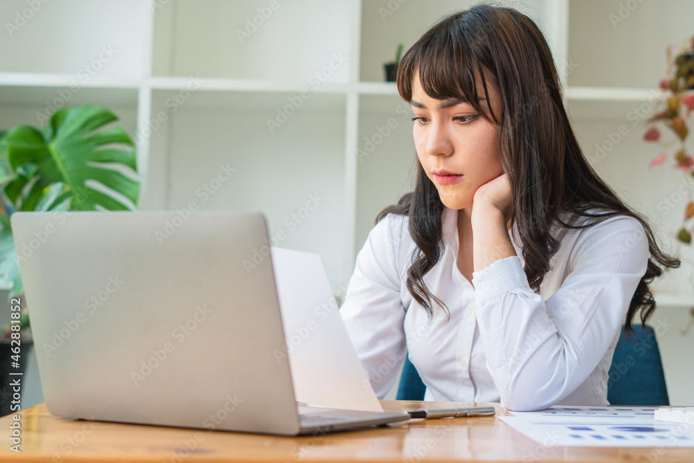 beautiful Asian business women checking document and using notebook and smiling happy for working beautiful Asian business women checking document and using notebook and smiling happy for working