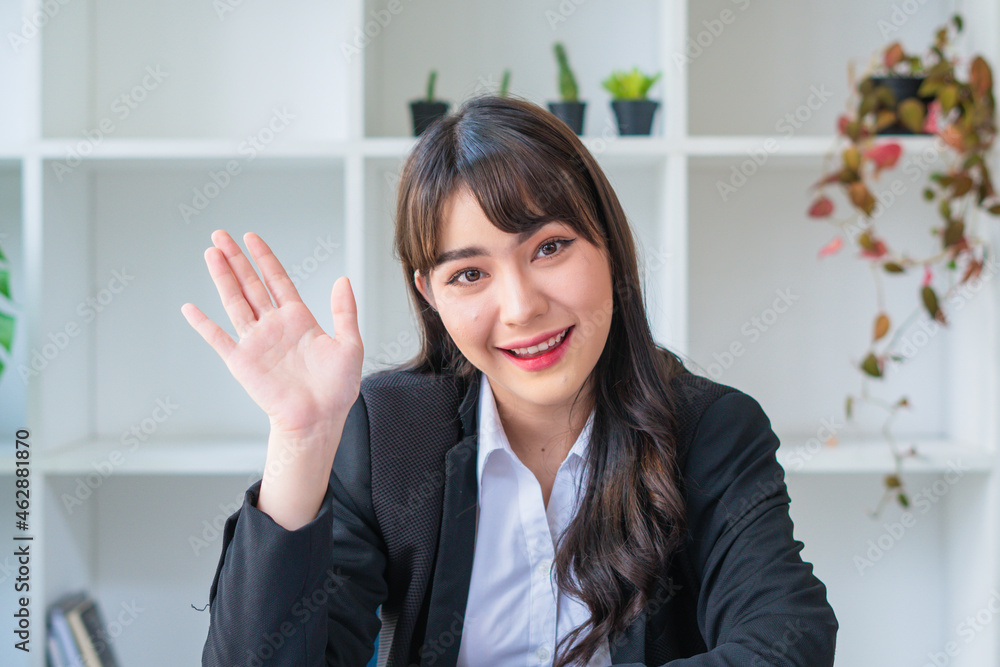 Business Asian woman feeling happy smiling and looking to camera while relax in living room at office. Business Asian woman feeling happy smiling and looking to camera while relax in living room at office.