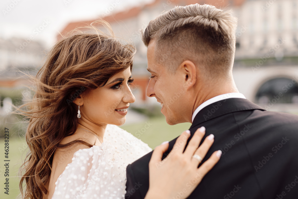 Wedding day, portrait close-up of bride and groom tenderly look at each other, happy together. Wedding day, portrait close-up of bride and groom tenderly look at each other, happy together.
