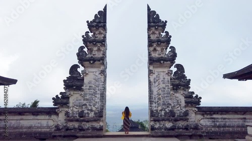 Tourists visit temple gates at Lempuyang Luhur temple in Bali, Indonesia. photo