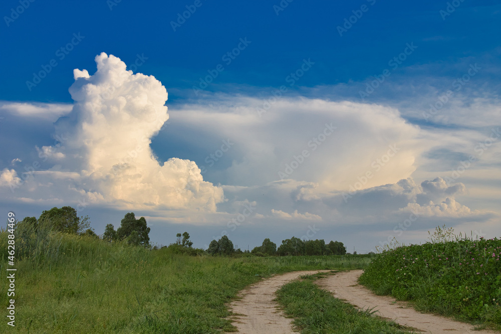 beautiful white clouds over a green field beautiful white clouds over a green field