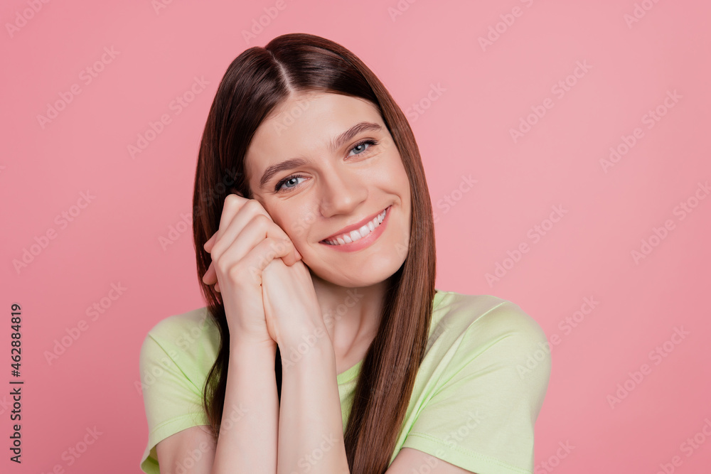 Portrait of nice girlish lady look in camera toothy smiling hands touch cheek dream isolated over pink color background Portrait of nice girlish lady look in camera toothy smiling hands touch cheek dream isolated over pink color background