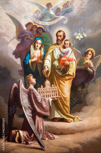ROME, ITALY - AUGUST 31, 2021: The painting of St. Joseph and Holy Family the church Chiesa del Sacro Cuore di Gesu probably by Giuseppe Rollini (1832).