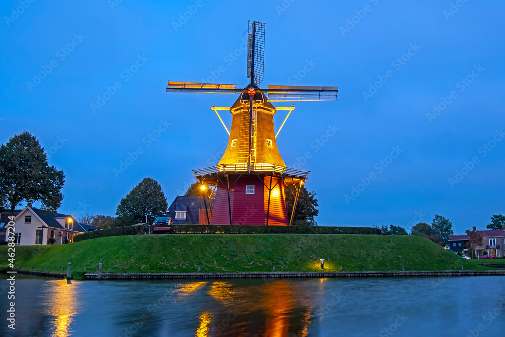 Windmill De Hoop in the historical city Dokkum in the Netherlands at sunset Windmill De Hoop in the historical city Dokkum in the Netherlands at sunset
