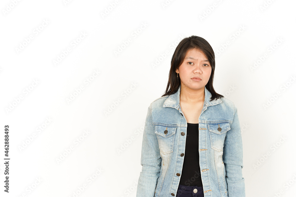 Standing and showing sad face Expression of Beautiful Asian Woman Wearing Jeans Jacket and black shirt Isolated On White Background Standing and showing sad face Expression of Beautiful Asian Woman Wearing Jeans Jacket and black shirt Isolated On White Background