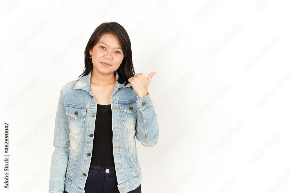 Pointing Side With Thumb of Beautiful Asian Woman Wearing Jeans Jacket and black shirt Isolated On White Background Pointing Side With Thumb of Beautiful Asian Woman Wearing Jeans Jacket and black shirt Isolated On White Background