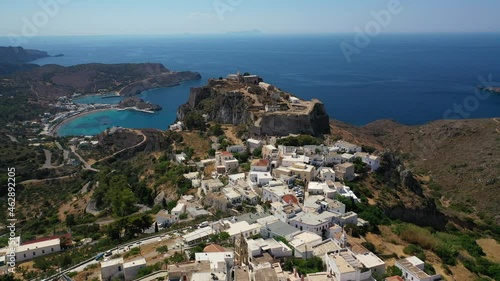Aerial drone video of iconic medieval castle of main village of Kithira island overlooking beautiful double bay and beach of Kapsali, Kythira island, Ionian, Greece photo