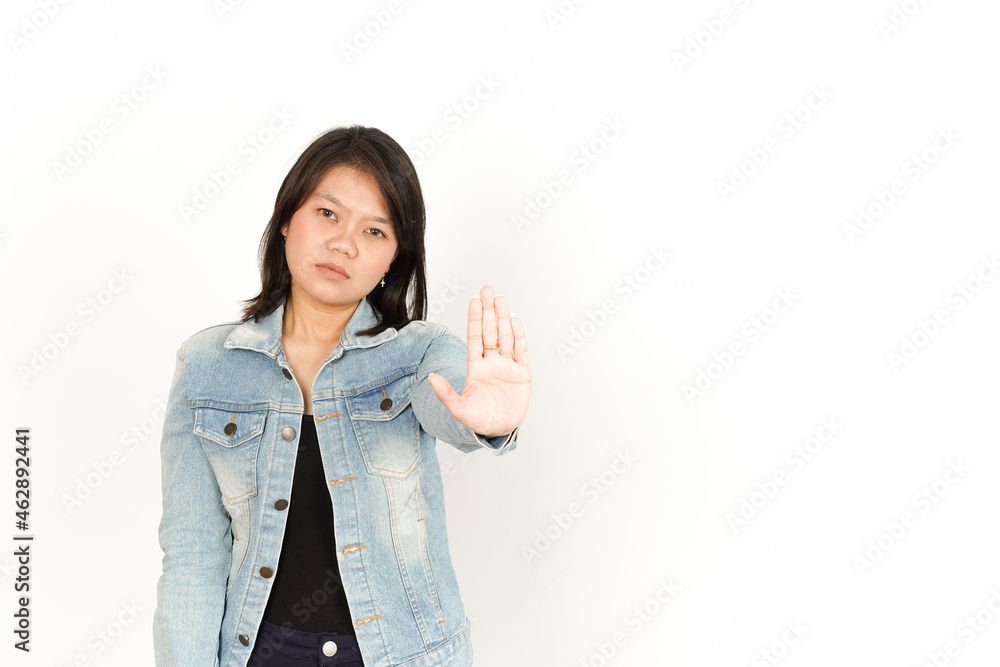 Stop hand gesture of Beautiful Asian Woman Wearing Jeans Jacket and black shirt Isolated On White Background Stop hand gesture of Beautiful Asian Woman Wearing Jeans Jacket and black shirt Isolated On White Background