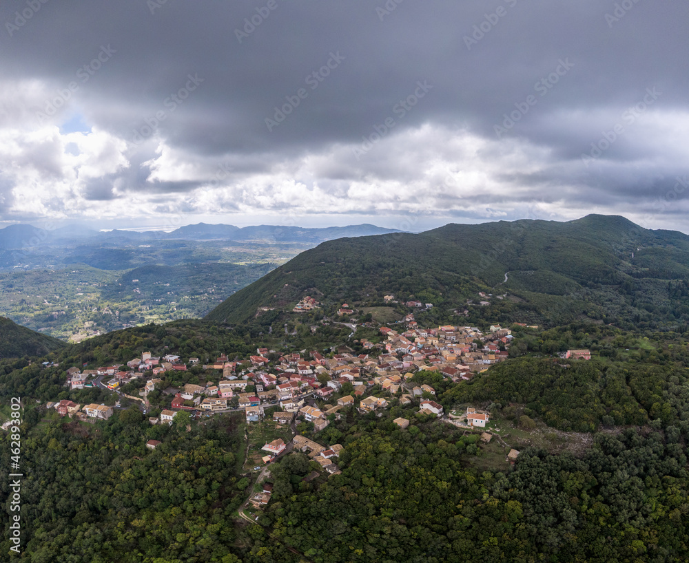 village in mountains covered with forest. View from Sokraki aerial view Corfu island, Greece