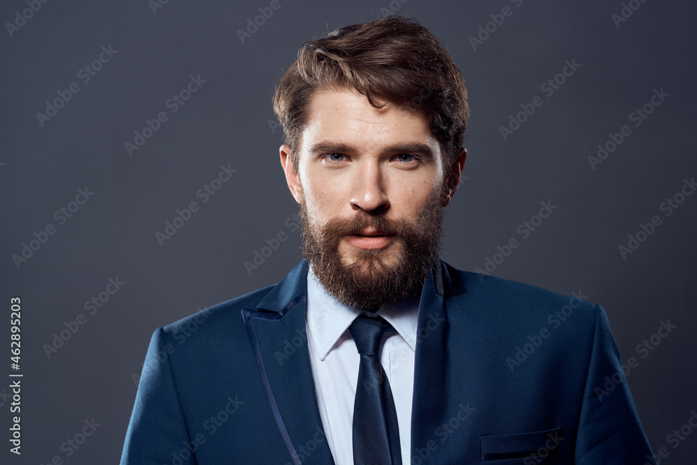 bearded man jacket with tie dark background bearded man jacket with tie dark background