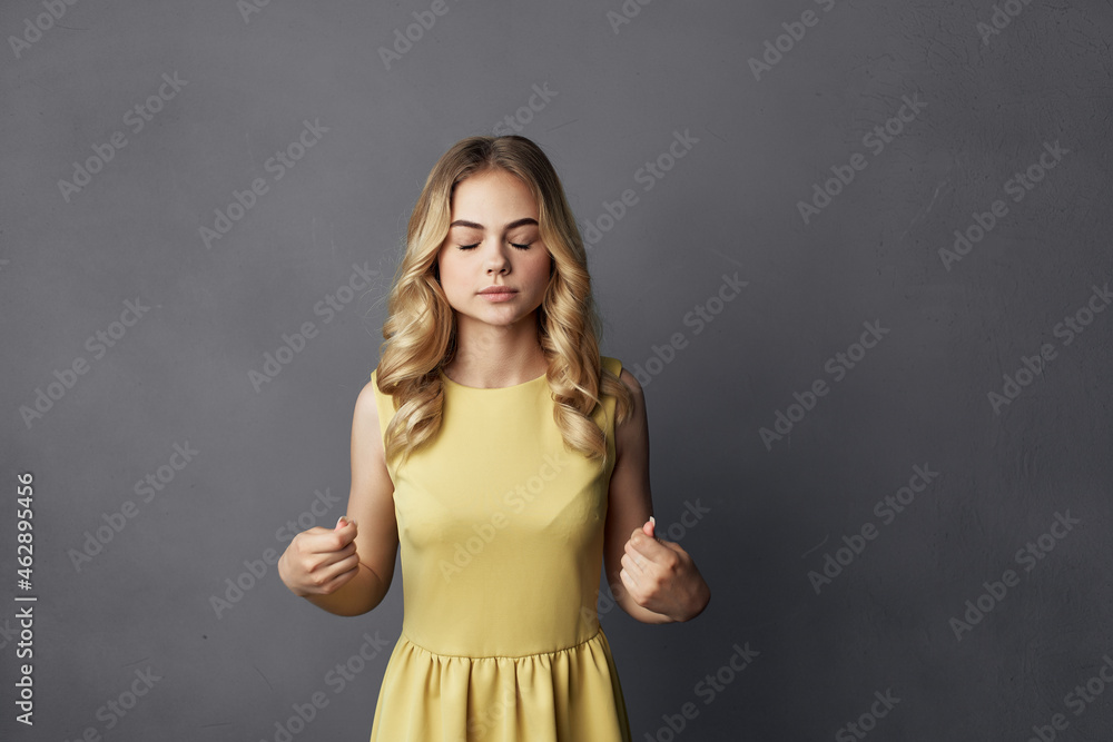 beautiful woman in a yellow dress fun cropped view fashion beautiful woman in a yellow dress fun cropped view fashion
