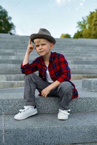 Children's date, macho boy waiting for a girl