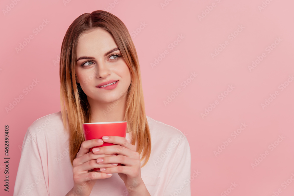 Minded curious lady hold cup drink coffee look empty space think ponder bite lip Minded curious lady hold cup drink coffee look empty space think ponder bite lip