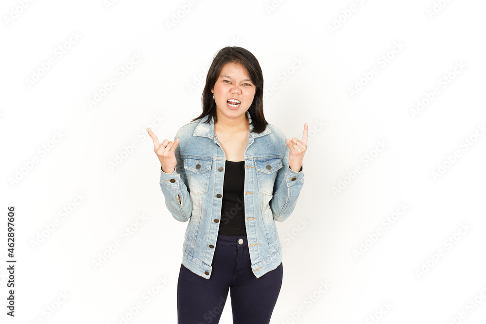 Showing Metal Hand of Beautiful Asian Woman Wearing Jeans Jacket and black shirt Isolated On White Background Showing Metal Hand of Beautiful Asian Woman Wearing Jeans Jacket and black shirt Isolated On White Background
