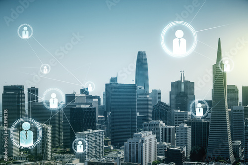 Abstract virtual social network hologram on San Francisco cityscape background. Double exposure