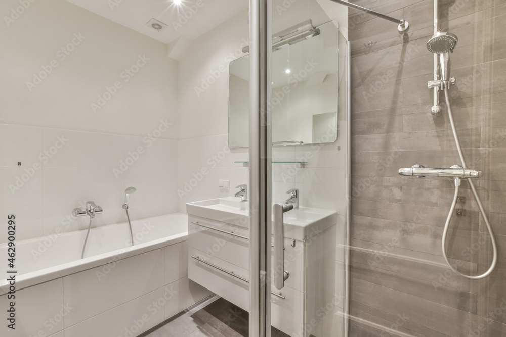 Restroom with bathtub and shower cabin Restroom with bathtub and shower cabin