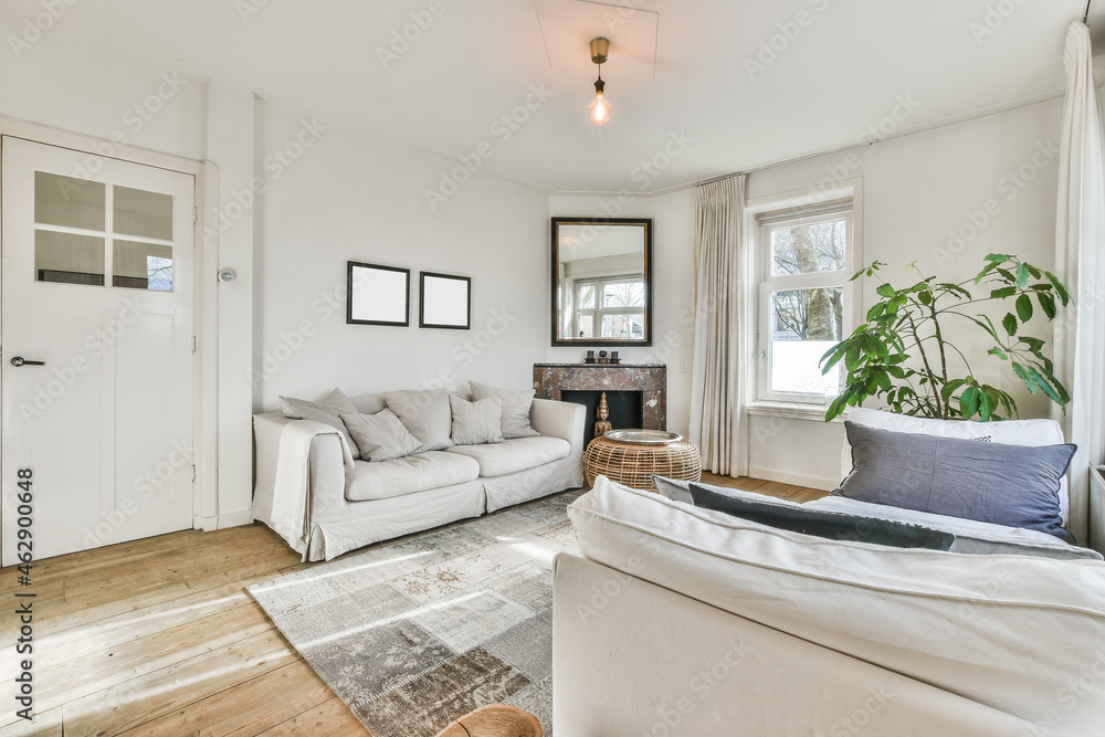 Modern room interior with sofas and carpet at home Modern room interior with sofas and carpet at home