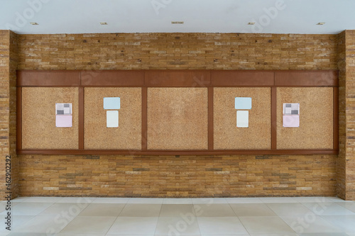 bulletin board with brick background
