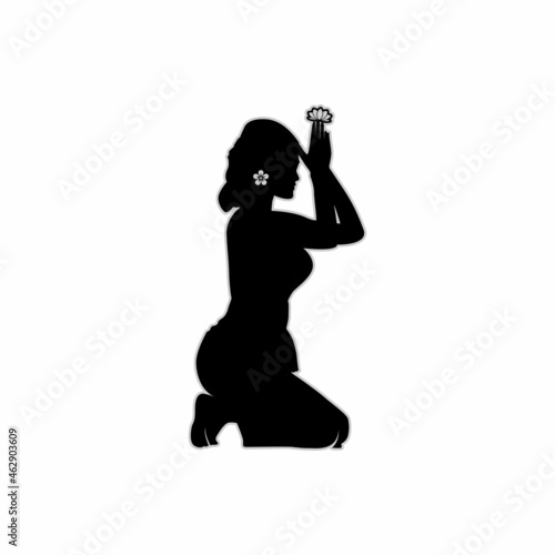 Silhouette of Exotic Balinese Woman Praying in Kebaya Vector Design Inspiration
