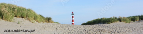 Red and white lighthouse on island Ameland, Dutch, Holland photo