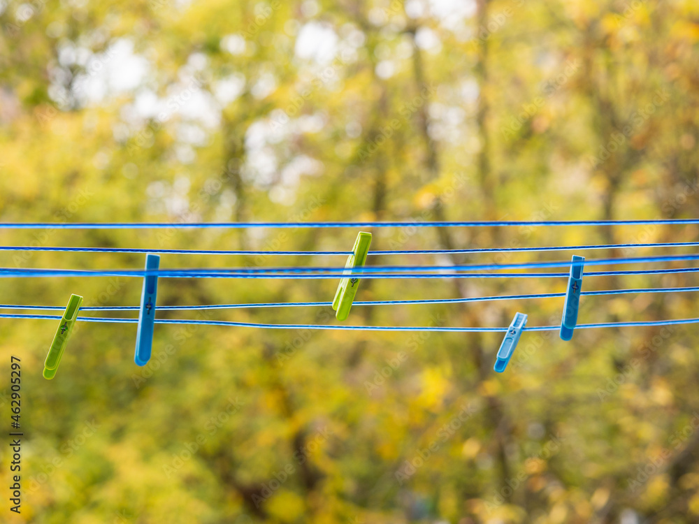 Clothes pin hanging on a clothesline Clothes pin hanging on a clothesline