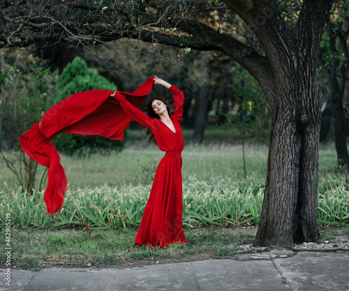 woman in red dress in forest charm luxury tree