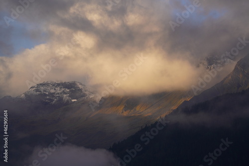 mystical autumn landscape in the mountains with view of the alps