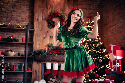 Photo of cheerful dreamy positive young woman santa helper christmas dance enjoy indoors inside house home
