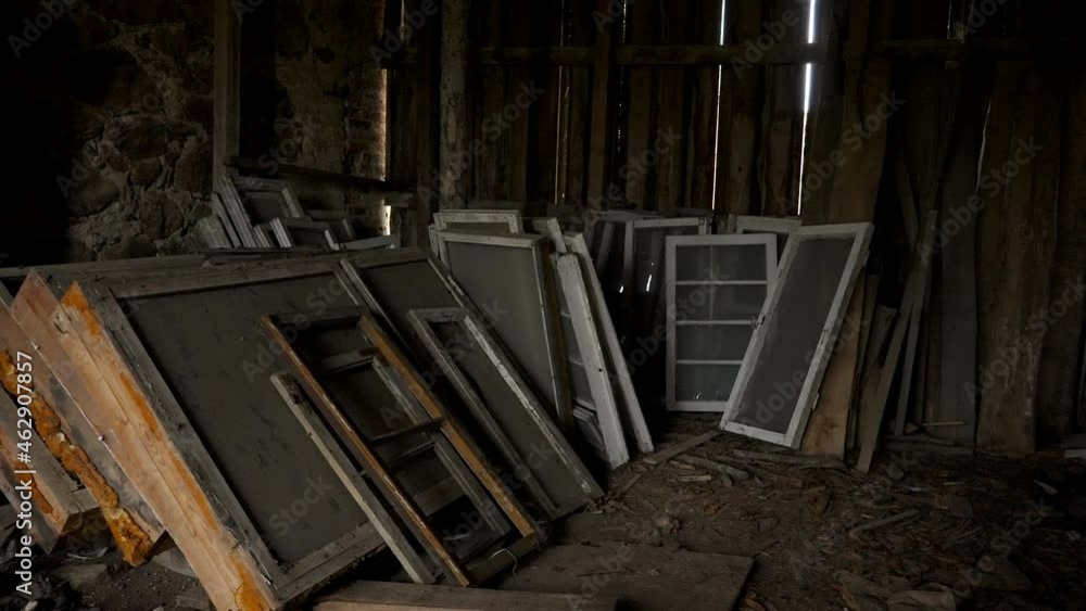 Lots of window and door panes on the storage area of the abandoned house in Estonia Lots of window and door panes on the storage area of the abandoned house in Estonia
