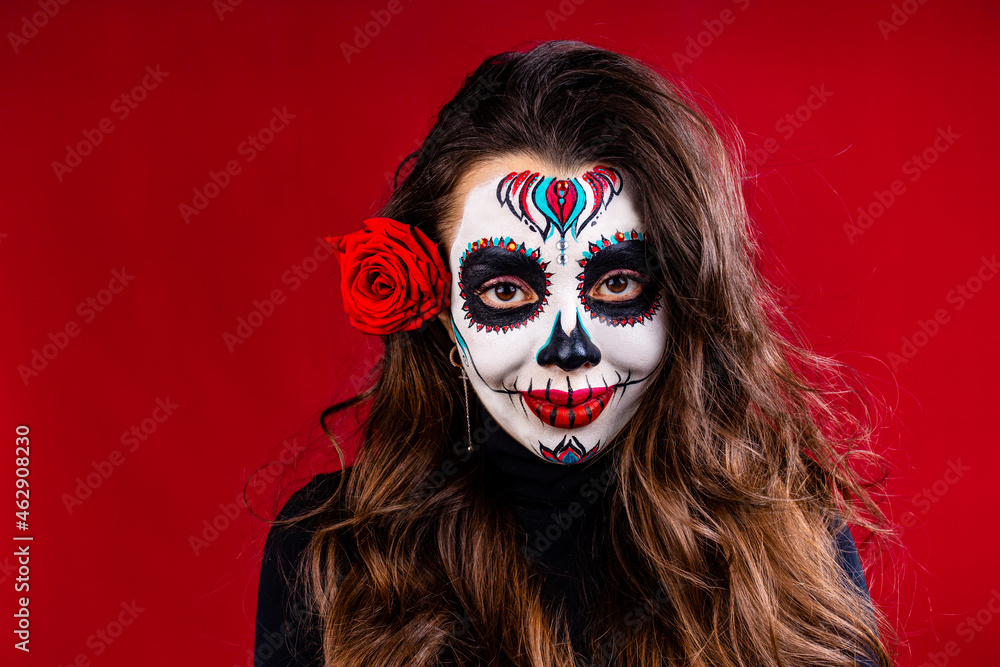 1st and 2nd november celebration of day of the dead in mexico concept woman with grimm skull face and black cloth in studio 1st and 2nd november celebration of day of the dead in mexico concept woman with grimm skull face and black cloth in studio
