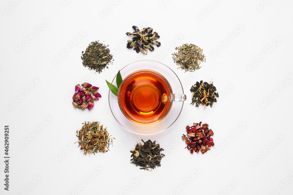 Composition with brewed tea, dry and fresh leaves on white background, top view - obrazy, fototapety, plakaty 